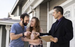 couple signing papers fr new house